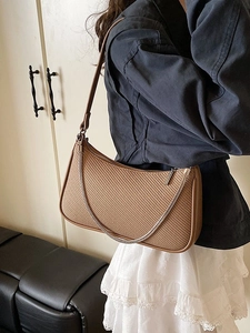 Brown woven hobo bag with silver chain and minimalist half-moon shape shoulder design