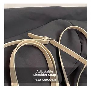 Close-up of adjustable beige PU leather strap with silver metal buckle detail