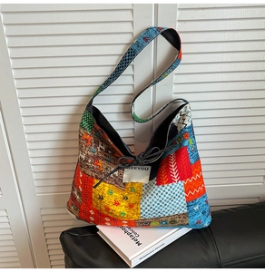 Detailed shot of ethnic patchwork denim bag with tribal patterns and SEE YOU label