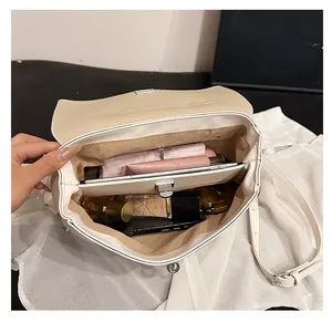 Detailed interior view showing spacious multi-layer compartments and silver metal lock