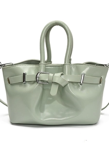 Retro light green bucket handbag in shiny leather with a crossbody strap and silver buckle