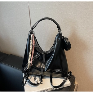 Fashionable black glossy leather tote bag with round coin purse and woven rope handle