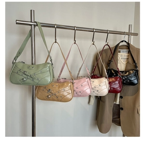 Detailed look at motor-style shoulder bags in six vibrant colors with rivets and buckles