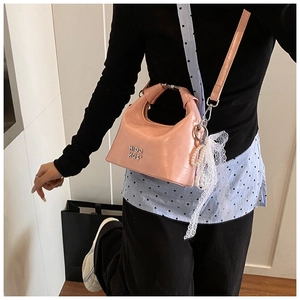 Pink crescent crossbody bag with pearl lace pendant and metallic letter logo detail