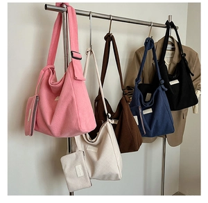 Detail of hobo corduroy tote bags in five colors with matching zipper coin purses