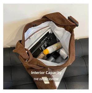 Internal view of the brown corduroy bucket bag showing its large storage capacity