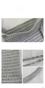 Detail of silver metallic woven handbag showing intricate texture and metal chain strap