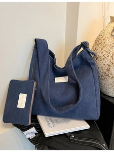 Stylish blue corduroy tote bag set with adjustable strap and matching pouch in retro scene