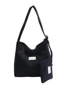 Large black corduroy tote bag for women with matching small pouch and white logo patch