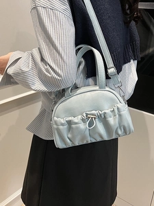 Blue ruched leather pillow bag for women with handles and adjustable shoulder strap