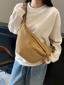 Khaki large capacity crescent crossbody bag with wide shoulder strap and woven zipper
