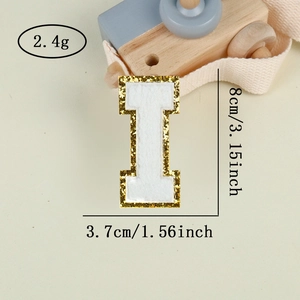 Macro shot of letter I chenille embroidery patch with gold glitter edge, 8x3.7cm size