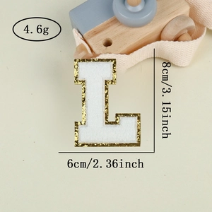 Detail of white chenille embroidery letter L patch with gold glitter borders 8x6cm