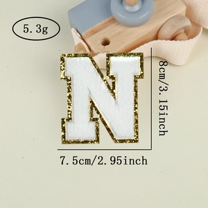 Detail of chenille letter N patch with gold sequins, measuring 8cm by 7.5cm