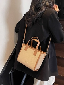 Straw patchwork bucket bag with leather trim and adjustable strap for women