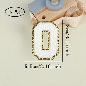 Detail of chenille number 0 patch with gold glitter edge, 8cm height for DIY decor