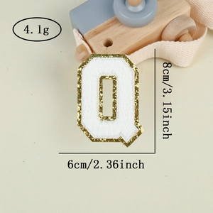 Detail of chenille letter Q patch with gold sequins, height 8cm for apparel DIY