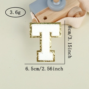 Detail of chenille letter T patch with gold glitter edge, 8cm height measurement