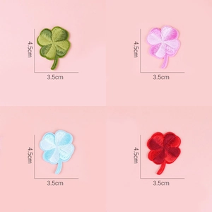 Close-up of four-leaf clover embroidery patches in vibrant colors with size 4.5x3.5cm