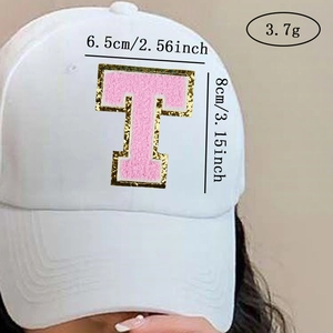 Pink chenille letter T patch with gold sequins on white cap measuring 6.5x8cm