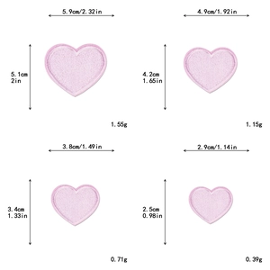 Detail of four sizes of pink heart embroidery patches with precise measurements