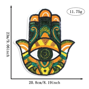 Close-up of colorful Hamsa Hand and Evil Eye sequin patch with size and weight details