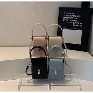 Detailed view of woven texture and silver locks on colorful mini crossbody bags