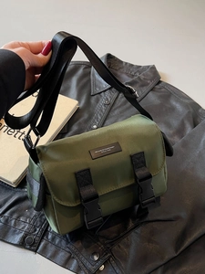 Olive green messenger bag with durable nylon fabric and dual buckle closure design