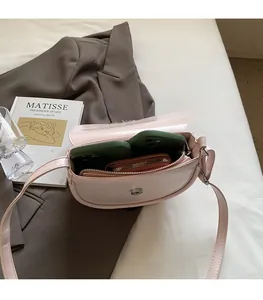 Interior view of the semi-circular saddle bag showing storage for phone cases and a wallet