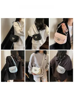 Saddle crossbody bag detail showing various colors and stylish bow buckle on PU leather