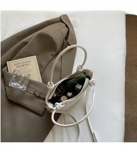 Detailed view of the white shoulder bag interior with spacious storage for daily items