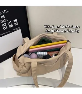 Top view of spacious beige canvas tote bag interior showing laptop and daily essentials