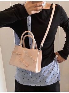 Pink faux leather handbag with stylish bows and Girl metal logo for daily commuting