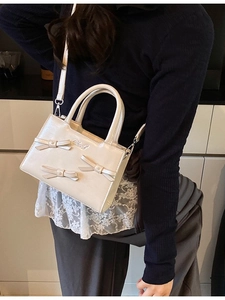 Cream mini tote bag with decorative 3D bows and detachable crossbody strap