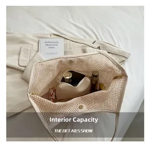 Detail showing woven mesh tote bag with internal storage pouch and magnetic closure