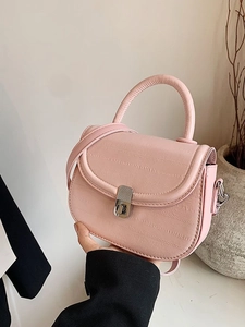 Elegant light pink saddle bag with silver clasp and textured leather for women