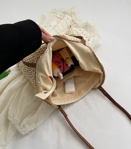 Detail of woven tote bag interior featuring zipper pocket and cotton lining with skin care items