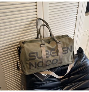 Army green canvas travel bag with rope handles and Suberen Noco print details