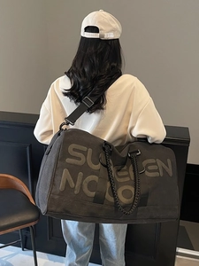 Large capacity travel duffel bag with SUPERN NC print and adjustable shoulder strap