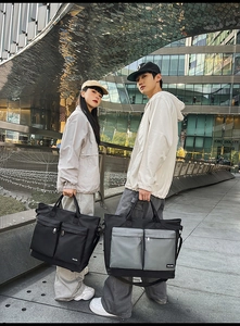 Close-up of waterproof nylon travel bags with large capacity pockets and shoulder straps