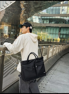 Practical large capacity travel bag featuring dual front zip pockets and adjustable strap