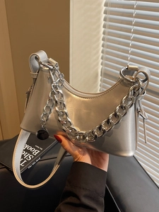 Metallic silver crescent shoulder bag with chunky chain strap and smooth shiny finish