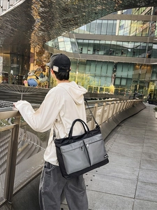 Black and gray waterproof nylon travel duffel bag with multi-pocket functional design