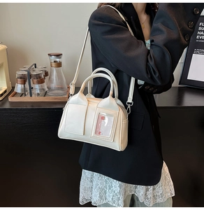 Detail of cream Boston handbag with a transparent card slot on high-quality PU leather