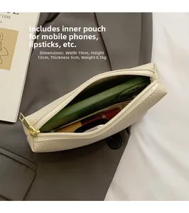 Detail of beige textured bucket bag showing 19cm width capacity with phone and lipstick
