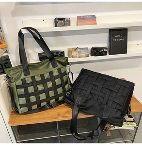 Close-up of green and black nylon tote bags featuring stylish woven webbing straps
