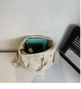 Top view of large capacity nylon bag interior showing tablet and daily storage space