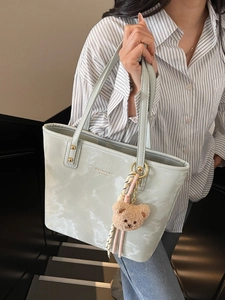 Mint green marble-pattern bucket bag with golden charms and plush bear pendant