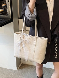 Chic beige tote bag with embossed texture and lace pearl charm for women