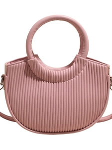 Pink pleated crescent bucket bag with elegant circular handle and adjustable strap